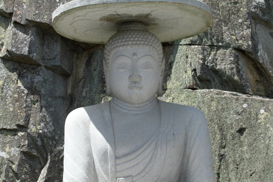 Just one of several carved Buddha statues at one of the shrines within Haedong Yonggungsa.